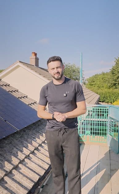 A Geko engineer on the roof ridge at Pete & Sarah's home