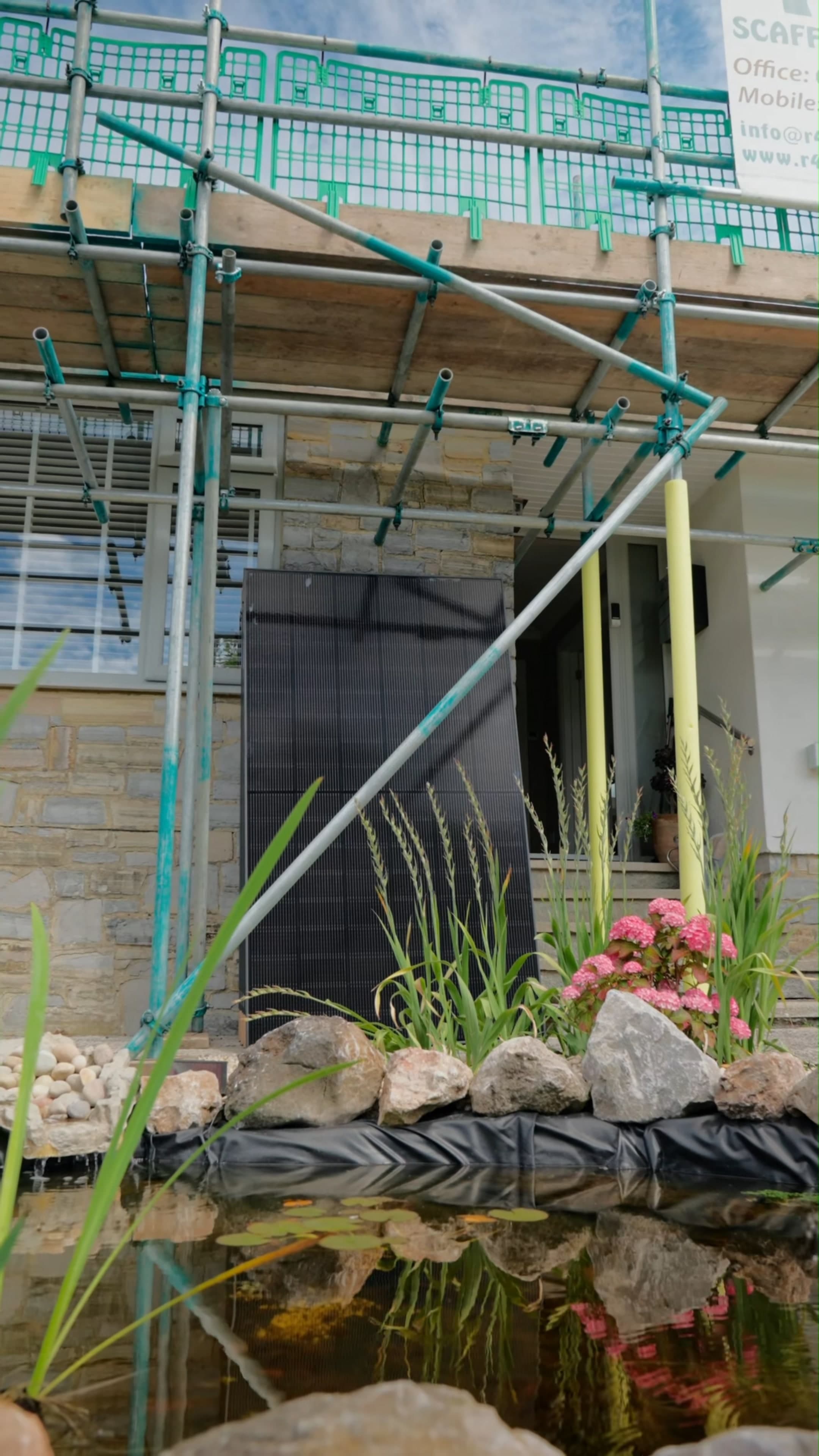 A panel ready to fit, against the scaffolding at Pete & Sarah's home